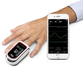 patient hand wearing pulse ox with iphone displaying personal health app